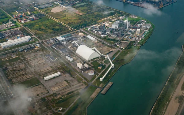 Aerial view of factories in industrial district. Property, land and real estate business.