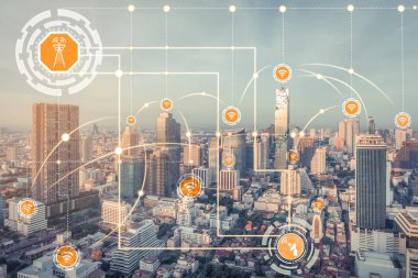 Smart city wireless communication network with graphic showing concept of internet of things ( IOT ) and information communication technology ( ICT ) against modern city buildings in the background. clipart