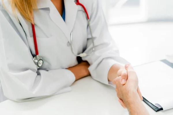 Woman Doctor Doing Handshake Male Patient Hospital Office Room Healthcare — Stock Photo, Image