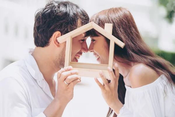 Young couple planning to buy a house and have happy living.