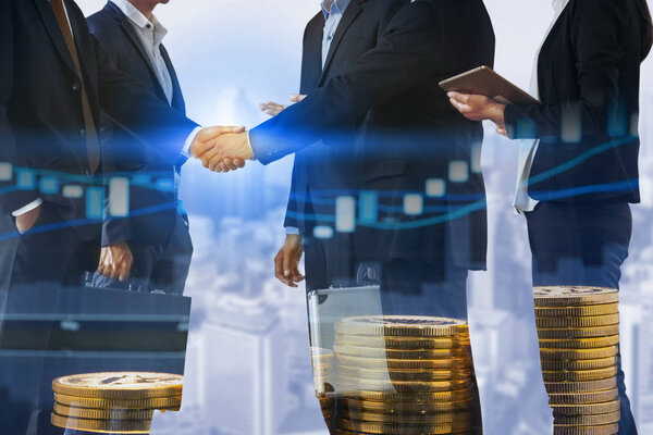 Double exposure business people handshake agreement with cityscape in background. Business executive meeting and collaboration.