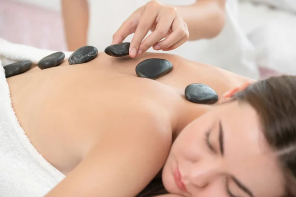 Woman Getting Hot Stone Massage Treatment Professional Beautician Therapist Spa Stock Image