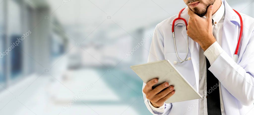 Doctor using tablet computer at the hospital. Medical healthcare and doctor staff service.