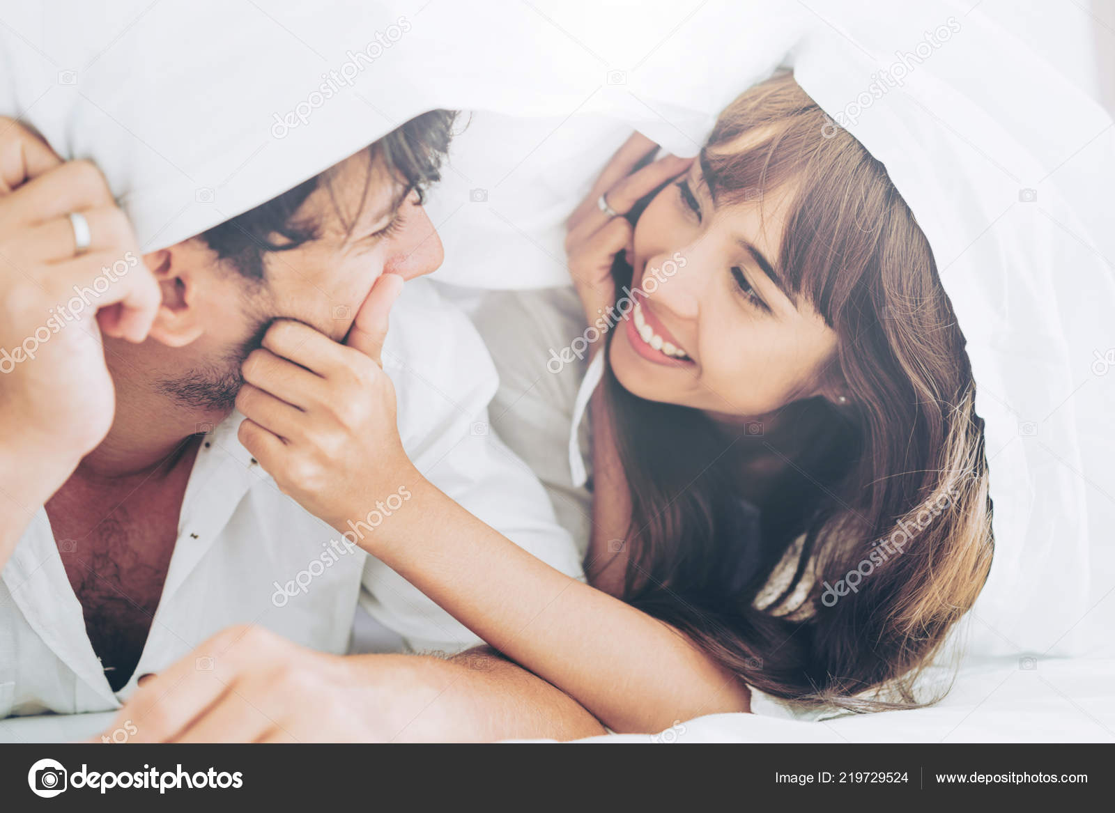 Happy Young Couple Relaxing Home Bedroom Waking Morning Stock Photo by ©BiancoBlue 219729524 image