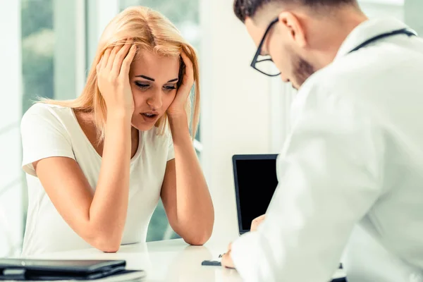 Male Doctor Talking Serious Female Patient Hospital Office Healthcare Medical — Stock Photo, Image