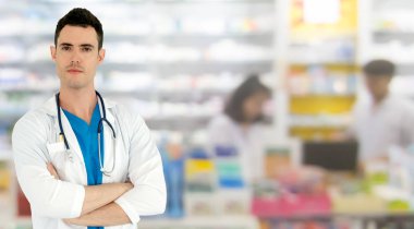 Young male pharmacist working at the pharmacy. Medical healthcare and pharmaceutical service. clipart