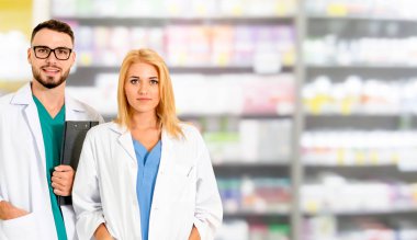 Pharmacist working with another pharmacist in the pharmacy. Healthcare and medical service. clipart