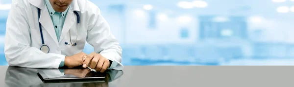 Male Doctor Sitting Table Tablet Computer Hospital Office Medical Healthcare — Stock Photo, Image