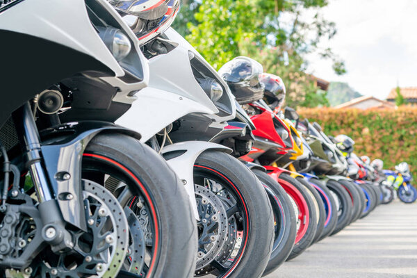 Motorcycles group parking on city street during adventure journey. Motorcyclists community travel concept.