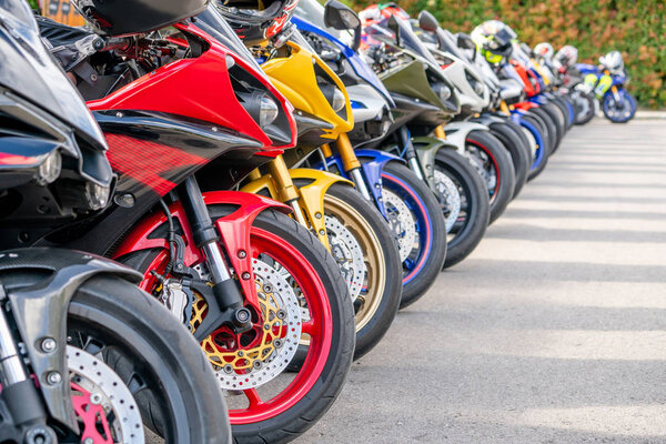 Motorcycles group parking on city street during adventure journey. Motorcyclists community travel concept.