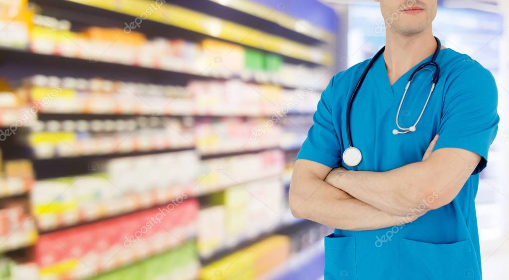 Young male pharmacist working at the pharmacy. Medical healthcare and pharmaceutical service.