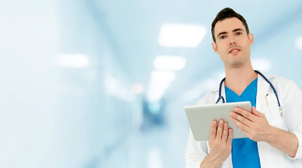 Doctor using tablet computer at the hospital. Medical healthcare and doctor staff service.