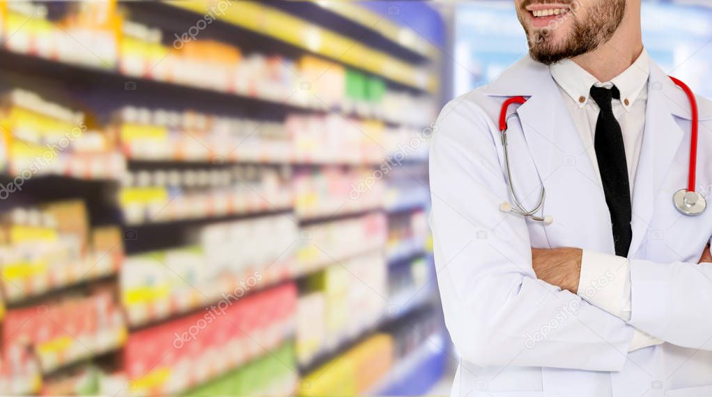 Young male pharmacist working at the pharmacy. Medical healthcare and pharmaceutical service.