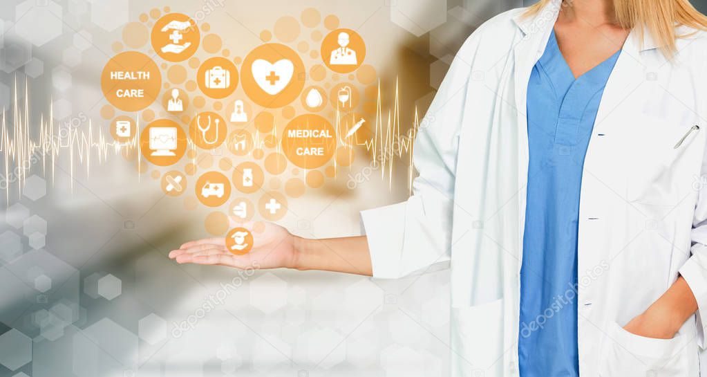 Medical Healthcare Concept - Doctor in hospital with digital medical icons graphic banner showing symbol of medicine, medical care people, emergency service network, doctor data of patient health.