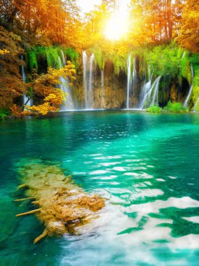 Exotic waterfall and lake landscape of Plitvice Lakes National Park, UNESCO natural world heritage and famous travel destination of Croatia. The lakes are located in central Croatia (Croatia proper). clipart