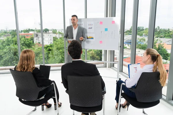 Businesswomen and businessmen attending group meeting conference in office room. Corporate business team concept.