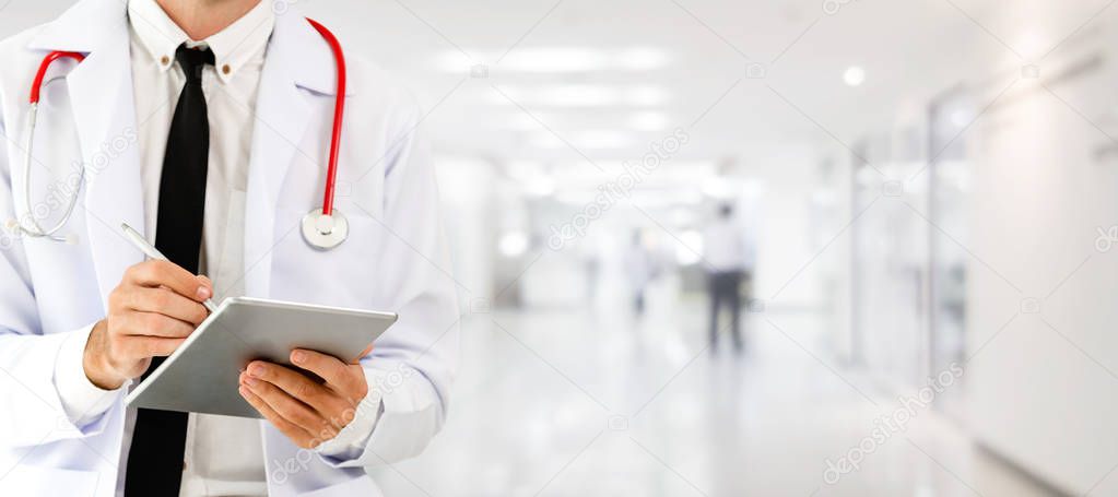 Doctor using tablet computer at the hospital. Medical healthcare and doctor staff service.