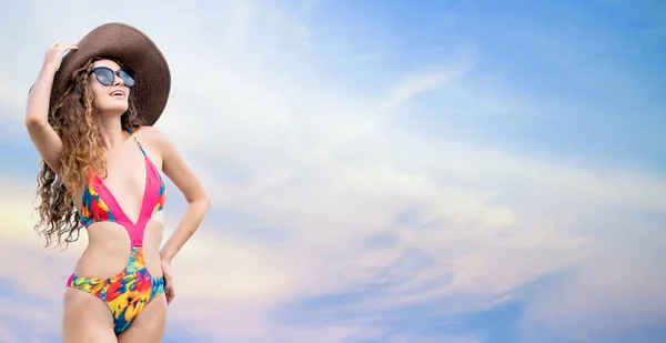 Woman in swimsuit posing on color background. — Stock Photo, Image