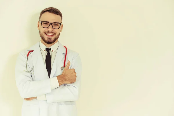 Doctor showing thumbs up on white background. — Stock Photo, Image