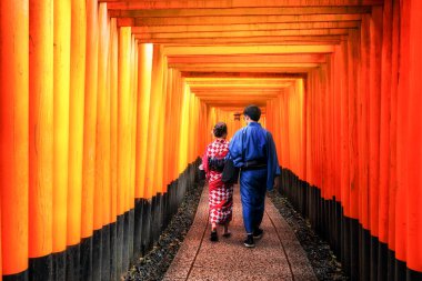 Traveler in Fushimi Inari Shrine, Kyoto, Japan clipart