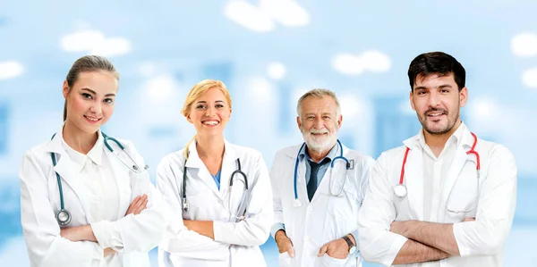 Doctor working in hospital with other doctors. — Stock Photo, Image