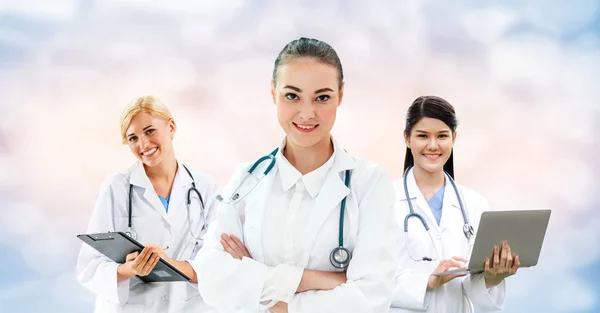 Doctor working in hospital with other doctors. Royalty Free Stock Images