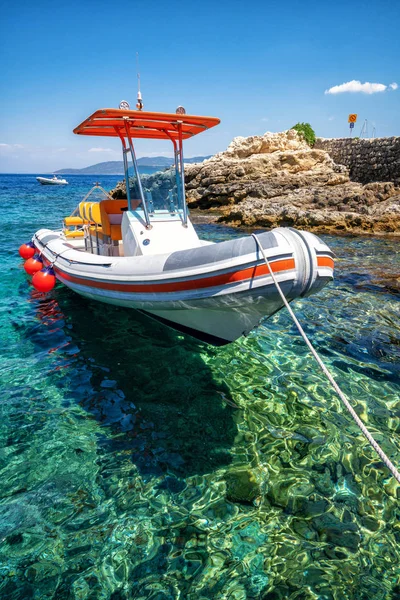 Motorboat on clear ocean water in Hvar, Croatia.