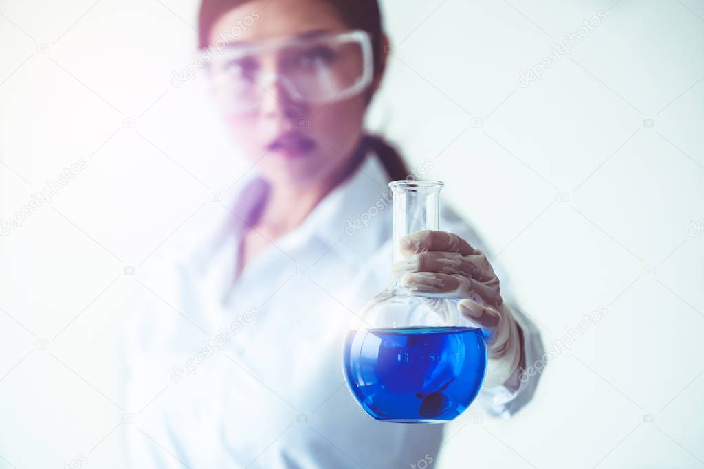 Scientist working in biochemistry laboratory.