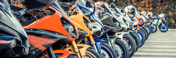 Motorcycles group parking on city street in summer