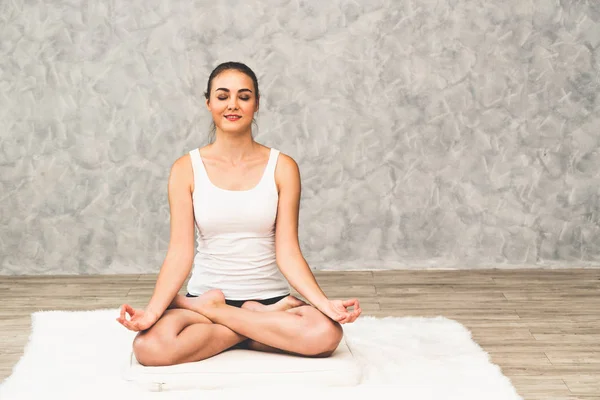 Young woman yoga on carpet at home living room. — Stock Photo, Image