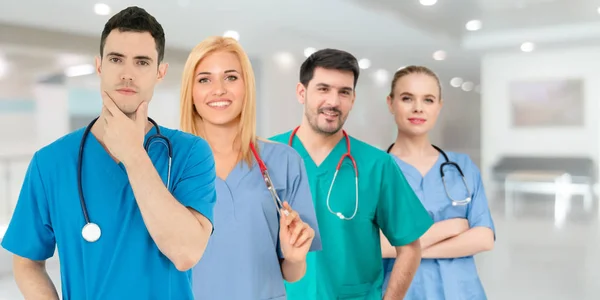 Doctor working in hospital with other doctors. — Stock Photo, Image