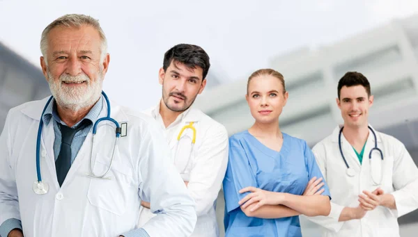 Doctor working in hospital with other doctors. — Stock Photo, Image