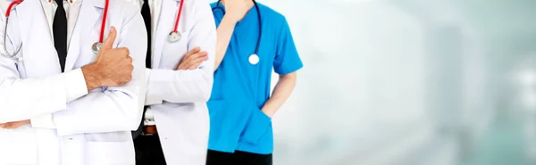 Doctor working in hospital with other doctors. — Stock Photo, Image