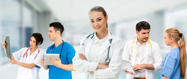 Doctor working in hospital with other doctors. Stock Image