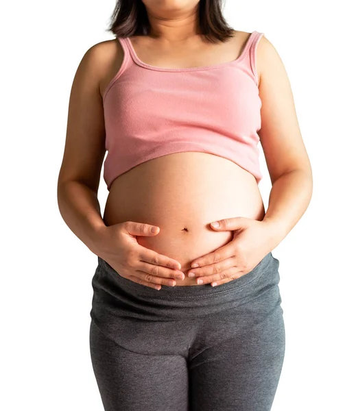 Gelukkig zwangere vrouw geïsoleerd op witte achtergrond. — Stockfoto