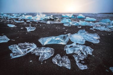 Icebergs on Diamond Beach in Iceland. clipart