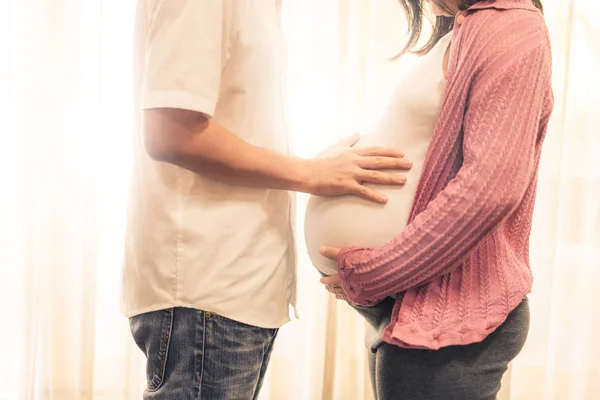 Pregnant couple feels love and relax at home. — Stock Photo, Image