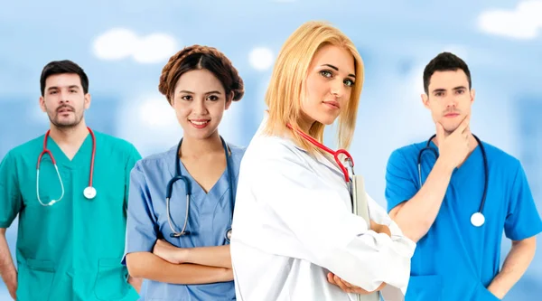 Doctor working in hospital with other doctors. — Stock Photo, Image