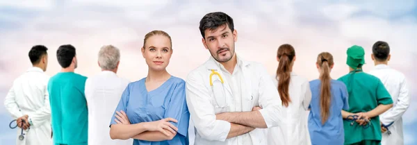 Doctor working in hospital with other doctors. — Stock Photo, Image