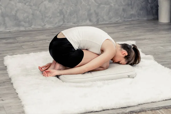 Young woman yoga on carpet at home living room. — Stock Photo, Image