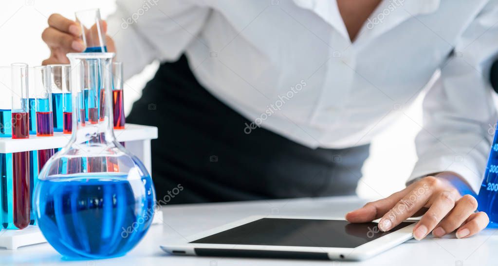 Scientist working in biochemistry laboratory.