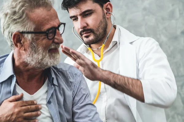 Senior patient visits doctor at the hospital.