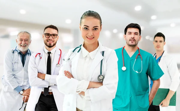 Doctor working in hospital with other doctors. — Stock Photo, Image