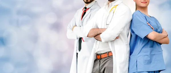 Doctor working in hospital with other doctors. — Stock Photo, Image