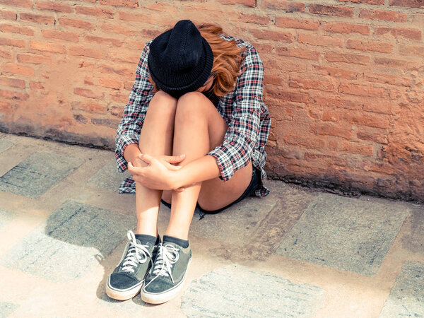 Depressed teenage woman feeling sad and lonely.