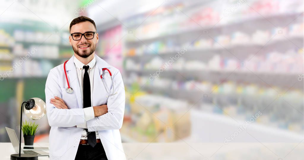 Pharmacist standing in pharmacy room.