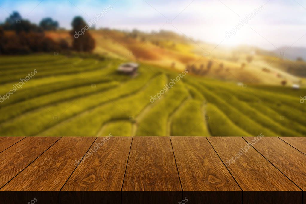 Wood table in autumn landscape with empty space.