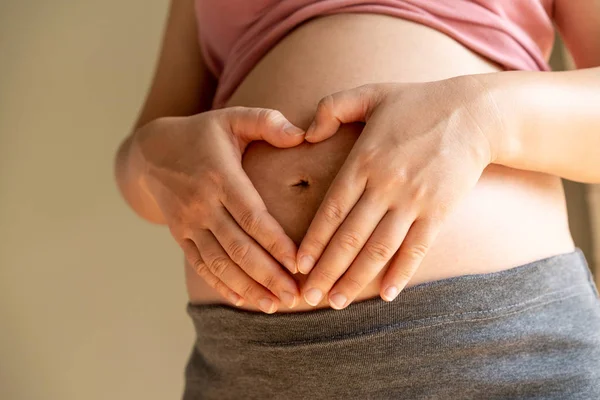 Happy pregnant woman and expecting baby at home. — Stock Photo, Image