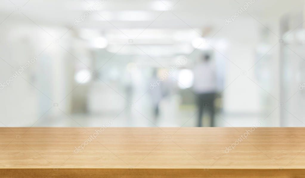 Wood table in modern hospital building interior.