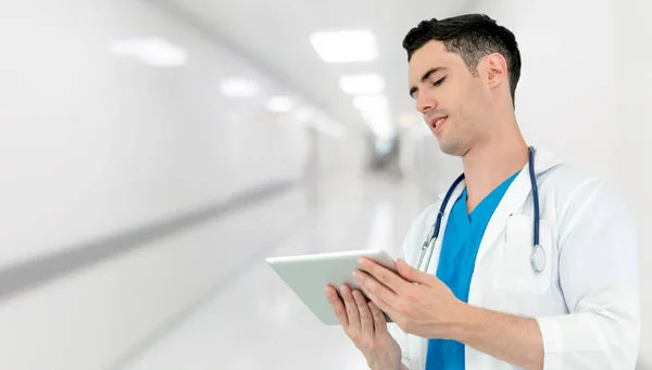 Doctor using tablet computer at hospital. Medical healthcare and doctor staff service.